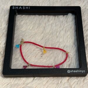 GIFT 🎁  READY. SHASHI Vibrant Red Beaded Bracelet with Multicolor Tassels